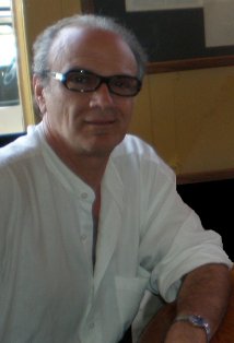 фото Джон А. Кури